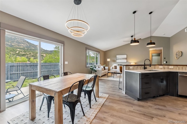143 Brady Rd, Buena Vista, CO 81211 - dining space featuring lofted ceiling, light wood-type flooring, a ceiling fan, and a chandelier