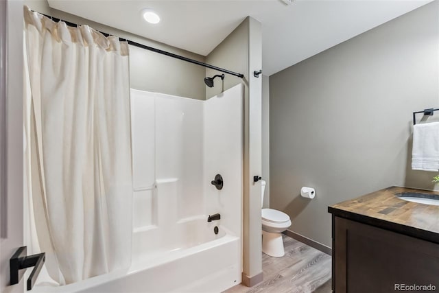 143 Brady Rd, Buena Vista, CO 81211 - bathroom with wood finished floors, toilet, shower / tub combo with curtain, vanity, and baseboards