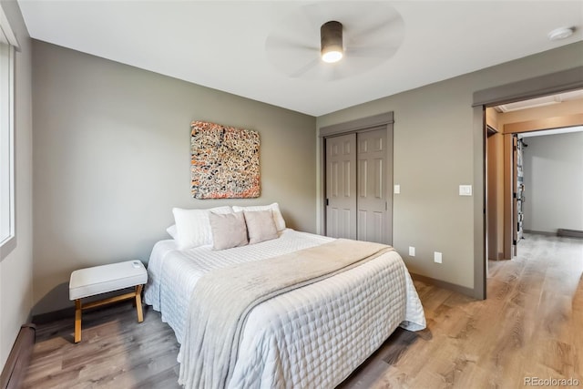 143 Brady Rd, Buena Vista, CO 81211 - bedroom featuring a closet, light wood-type flooring, baseboards, and baseboard heating