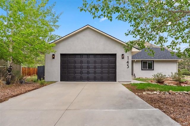 143 Brady Rd, Buena Vista, CO 81211 - ranch-style house featuring stucco siding, concrete driveway, and a garage