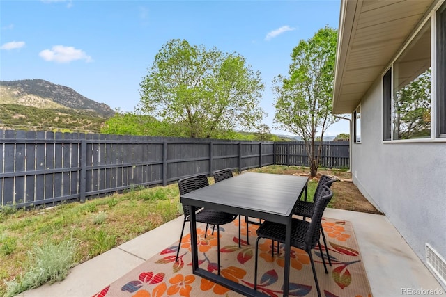 143 Brady Rd, Buena Vista, CO 81211 - fenced backyard featuring a mountain view, outdoor dining space, and a patio