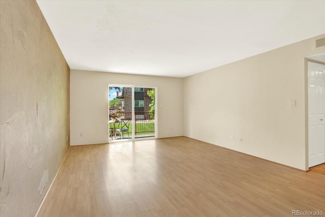 7755 E Quincy Ave Unit 206, Denver, CO 80237 - empty room featuring light wood-style floors