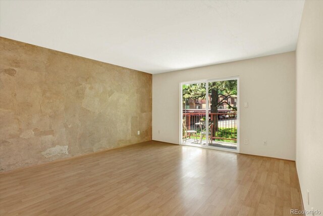 7755 E Quincy Ave Unit 206, Denver, CO 80237 - empty room with wood finished floors
