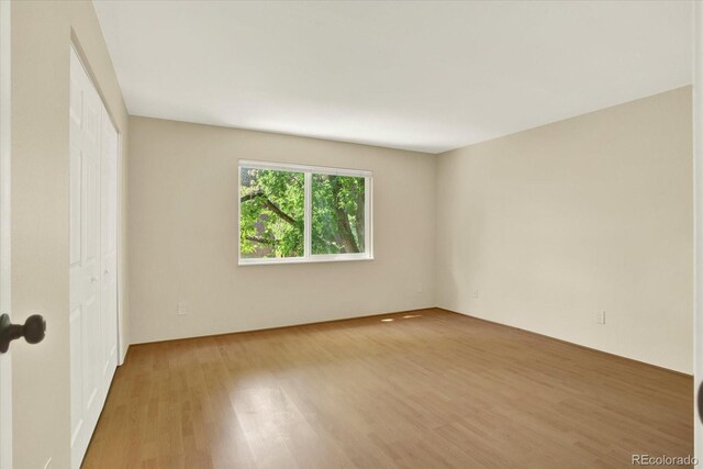 7755 E Quincy Ave Unit 206, Denver, CO 80237 - unfurnished bedroom featuring wood finished floors and a closet