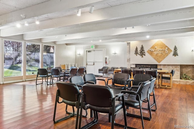 interior space with hardwood / wood-style flooring and beamed ceiling