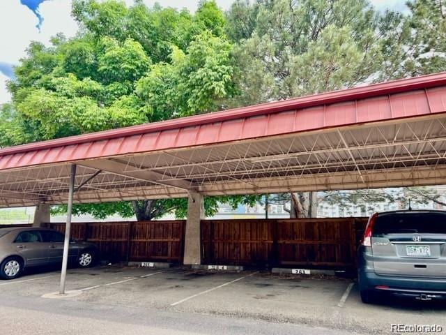 view of vehicle parking featuring a carport