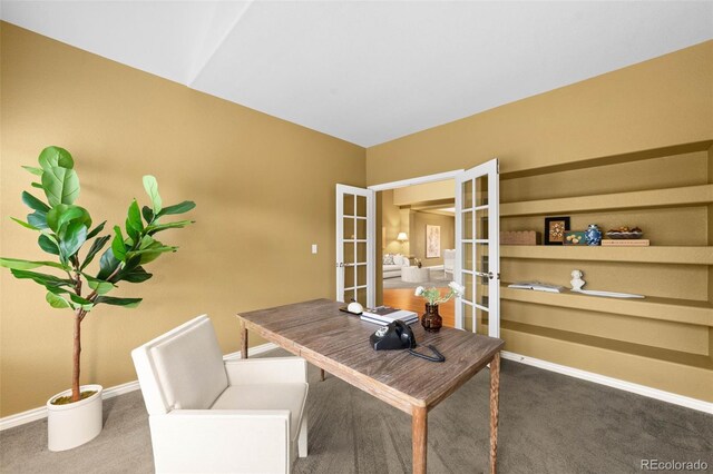 carpeted office space featuring french doors and baseboards