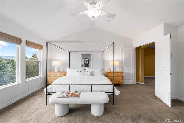 carpeted bedroom featuring lofted ceiling, ceiling fan, and baseboards