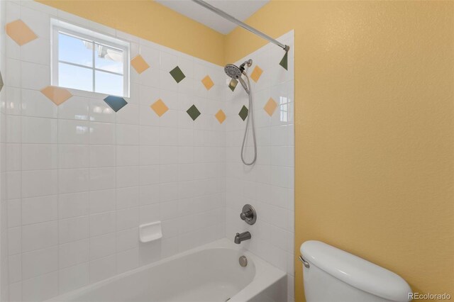 bathroom with toilet and bathtub / shower combination