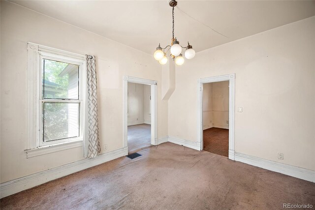 117 S Limit St, Colorado Springs, CO 80905 - unfurnished dining area with carpet, a chandelier, and baseboards
