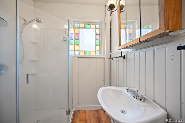117 S Limit St, Colorado Springs, CO 80905 - bathroom featuring a shower stall, a sink, and wood finished floors