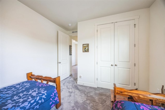 carpeted bedroom featuring a closet