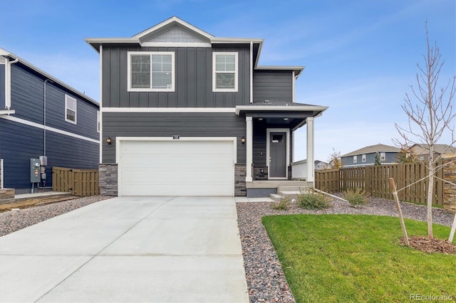 view of front of house featuring a front yard and a garage