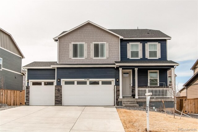13921 Scarlet Sage Ln, Parker, CO 80134 - view of front of property featuring a porch, driveway, fence, and stone siding