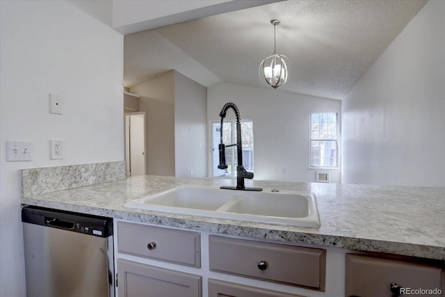 4361 Kirk Ct, Denver, CO 80249 - kitchen with light countertops, vaulted ceiling, dishwasher, a sink, and decorative light fixtures