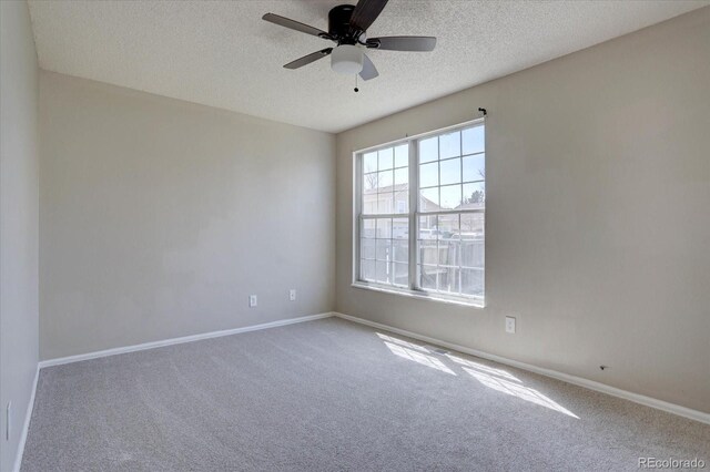 4361 Kirk Ct, Denver, CO 80249 - spare room with a textured ceiling, carpet flooring, baseboards, and ceiling fan