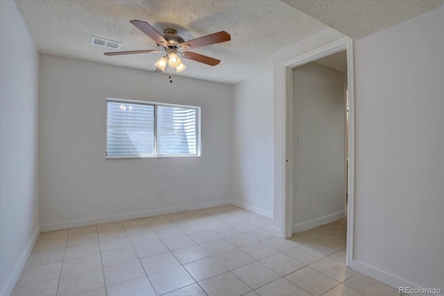 4361 Kirk Ct, Denver, CO 80249 - unfurnished room with a ceiling fan, a textured ceiling, light tile patterned floors, baseboards, and visible vents
