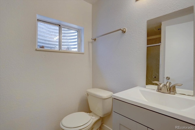 4361 Kirk Ct, Denver, CO 80249 - bathroom with a textured wall, toilet, and vanity