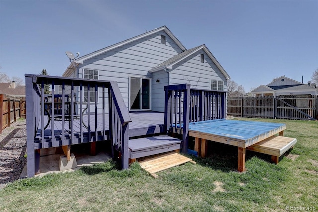 4361 Kirk Ct, Denver, CO 80249 - rear view of house with a fenced backyard, a yard, and a deck