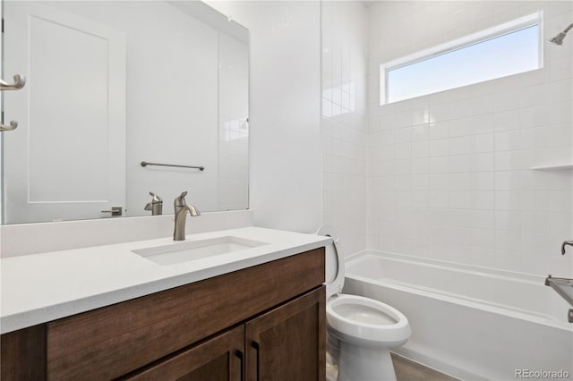 full bathroom with tub / shower combination, vanity, and toilet