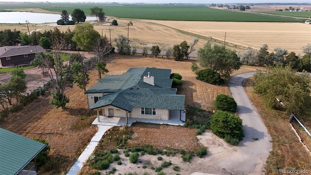 drone / aerial view featuring a water view and a rural view