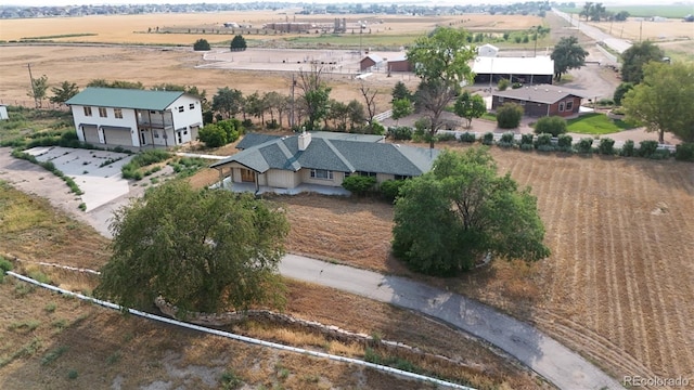 birds eye view of property featuring a rural view