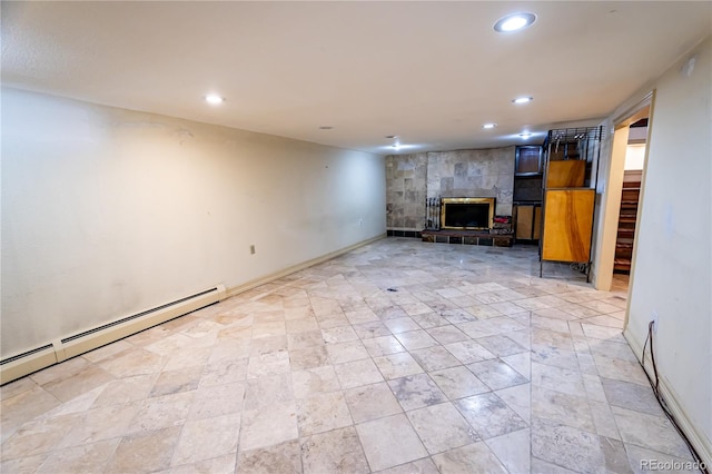 basement featuring a baseboard radiator and a tile fireplace