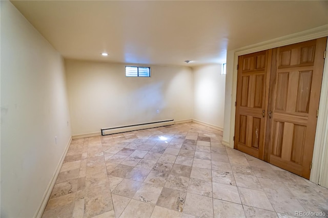 basement featuring a baseboard heating unit