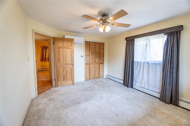 unfurnished bedroom featuring a baseboard heating unit, an AC wall unit, ceiling fan, and carpet floors