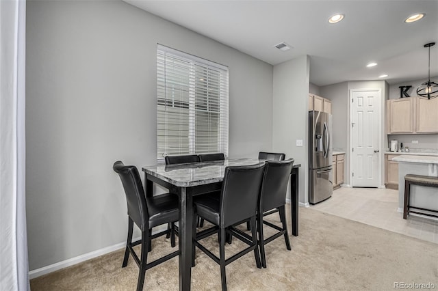 view of carpeted dining space