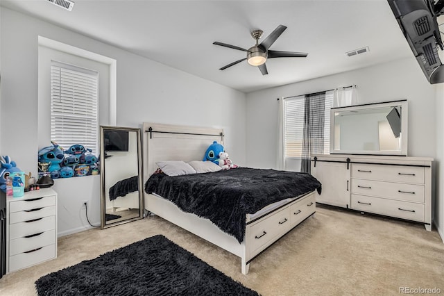 bedroom with light colored carpet and ceiling fan