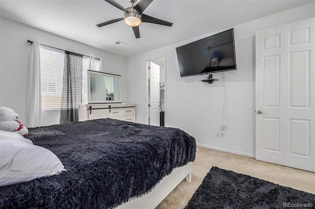 carpeted bedroom featuring ceiling fan