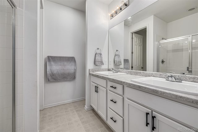 bathroom with walk in shower and vanity