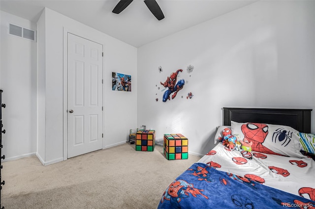 carpeted bedroom with ceiling fan