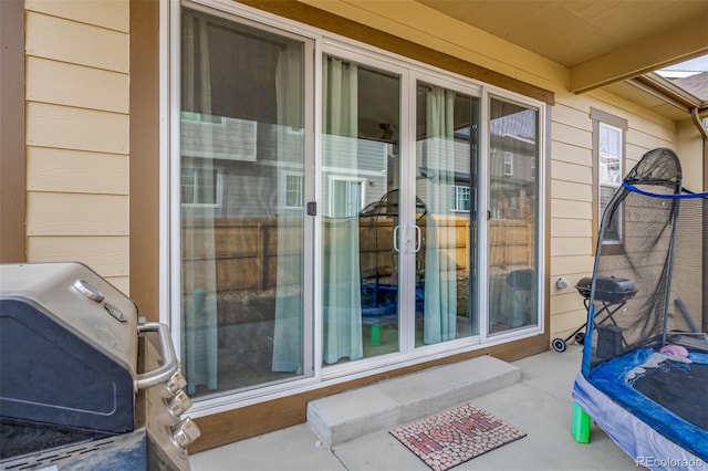 doorway to property featuring a patio area