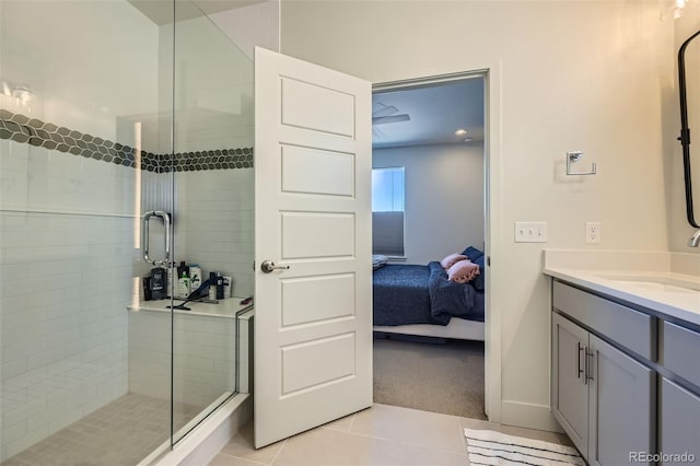 bathroom featuring a stall shower, vanity, connected bathroom, and tile patterned floors