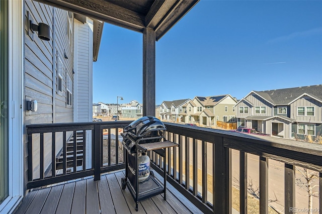 wooden deck with a residential view