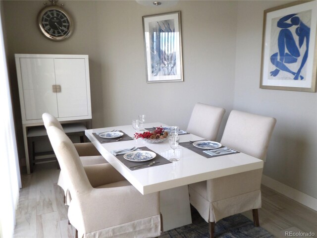 dining room with light wood-type flooring