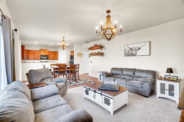 living room featuring recessed lighting and a chandelier