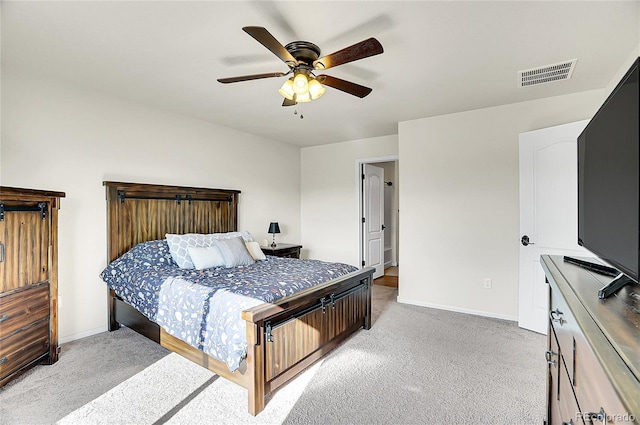 bedroom with light carpet, baseboards, and visible vents