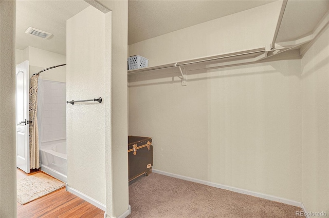walk in closet with visible vents