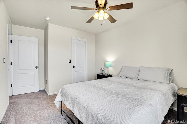 bedroom featuring carpet floors, a ceiling fan, and baseboards