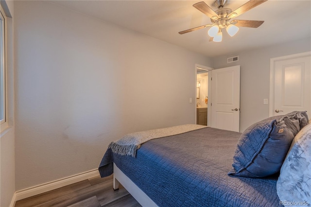 bedroom with dark wood-type flooring and ceiling fan