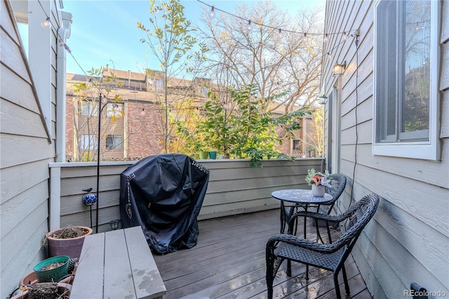 wooden deck featuring area for grilling