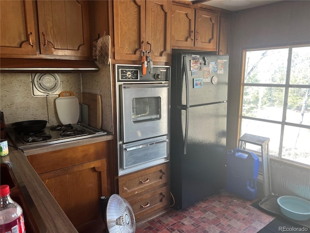 kitchen featuring a healthy amount of sunlight and stainless steel appliances