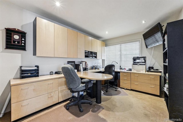 office featuring carpet, built in desk, and recessed lighting