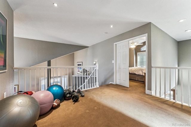 exercise room with carpet and recessed lighting