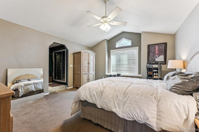 bedroom with carpet, baseboards, vaulted ceiling, and a ceiling fan