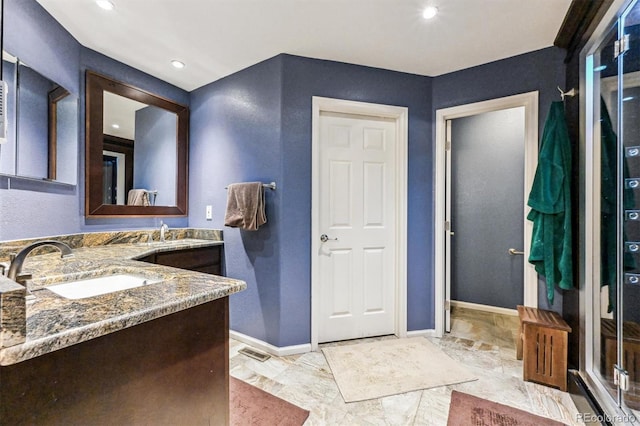 bathroom featuring recessed lighting, visible vents, baseboards, and vanity