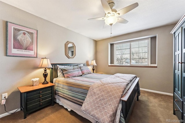 bedroom with ceiling fan, baseboards, and carpet flooring